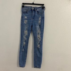 Distressed light blue denim jeans